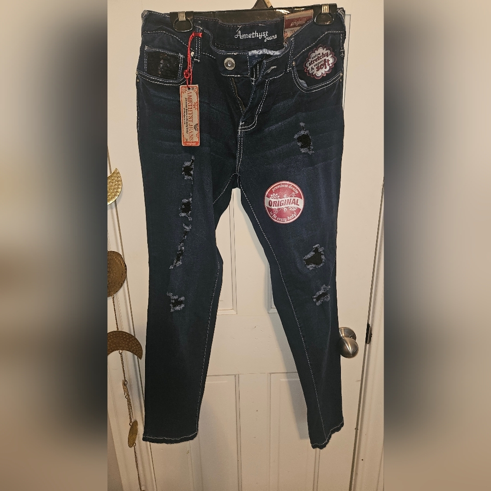 Amethyst jeans with distressing black sequins